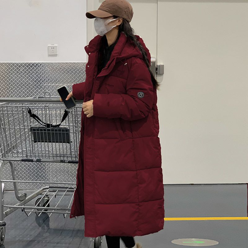 Long padded women's winter coat, loosely cut