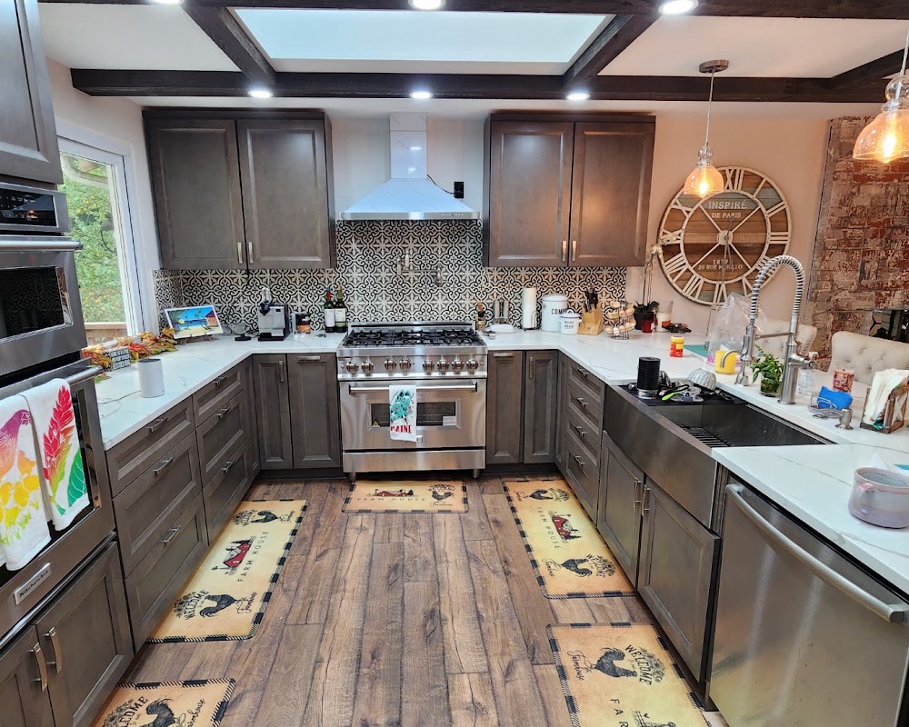Completed Phase 1 Silver Lake kitchen with dark cabinetry, island and skylights
