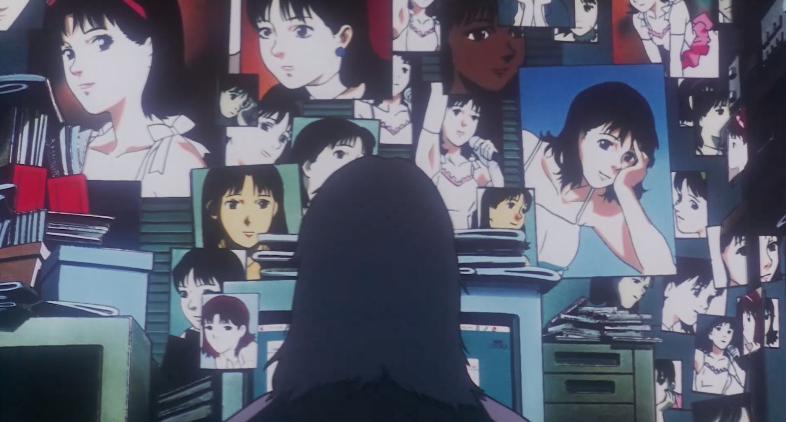 The back of a figure's head facing a wall covered in photos of Mima