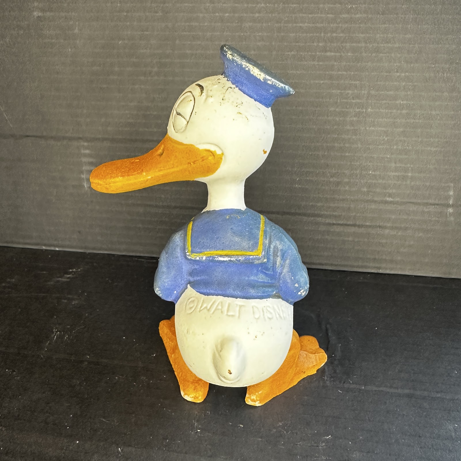 Vintage chalkware plaster figurine of Donald Duck in standing pose, showing age-appropriate paint wear, circa 1940s–1950s, Walt Disney Productions