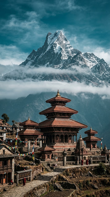 Traditional Himalayan Temple Buildings Against Snow Capped Mountains - Free mobile Wallpaper
