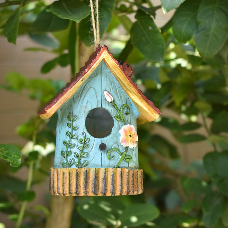 Decorative resin birdhouse for the wall