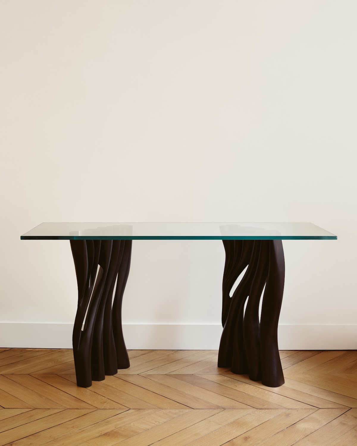 Console with sculpted base