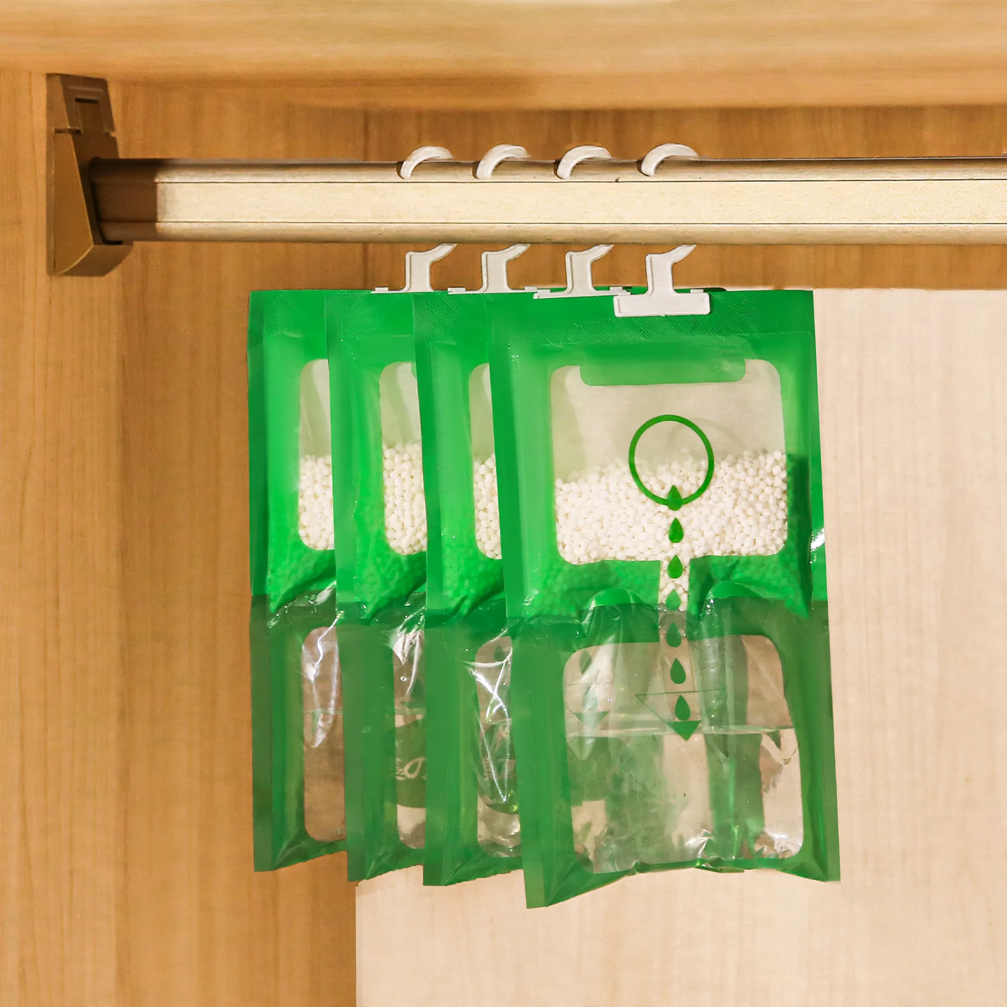 Hanging dehumidifying bag for closets and living spaces