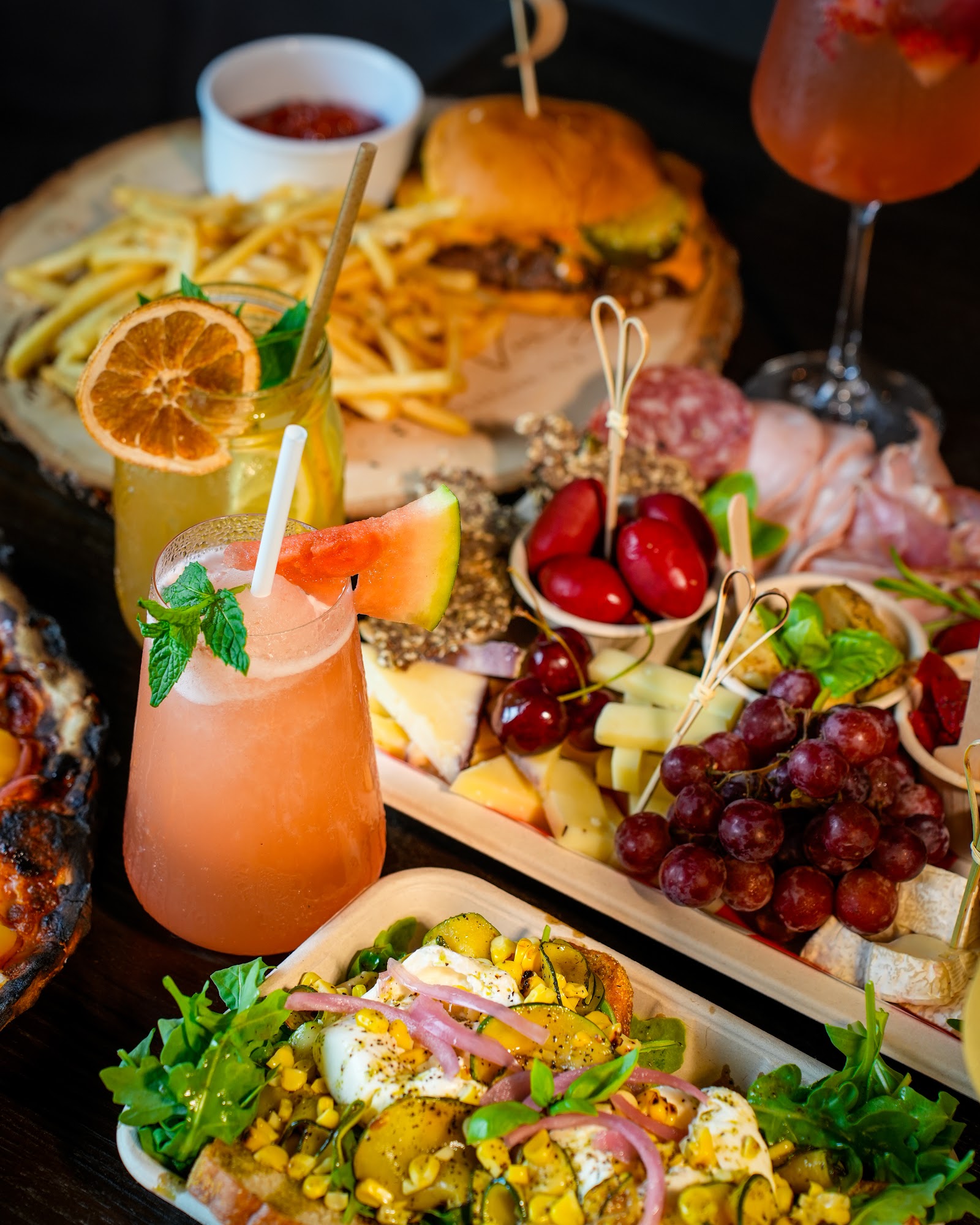 Full table spread with burgers, charcuterie and cocktails — restaurant photography Hudson Valley