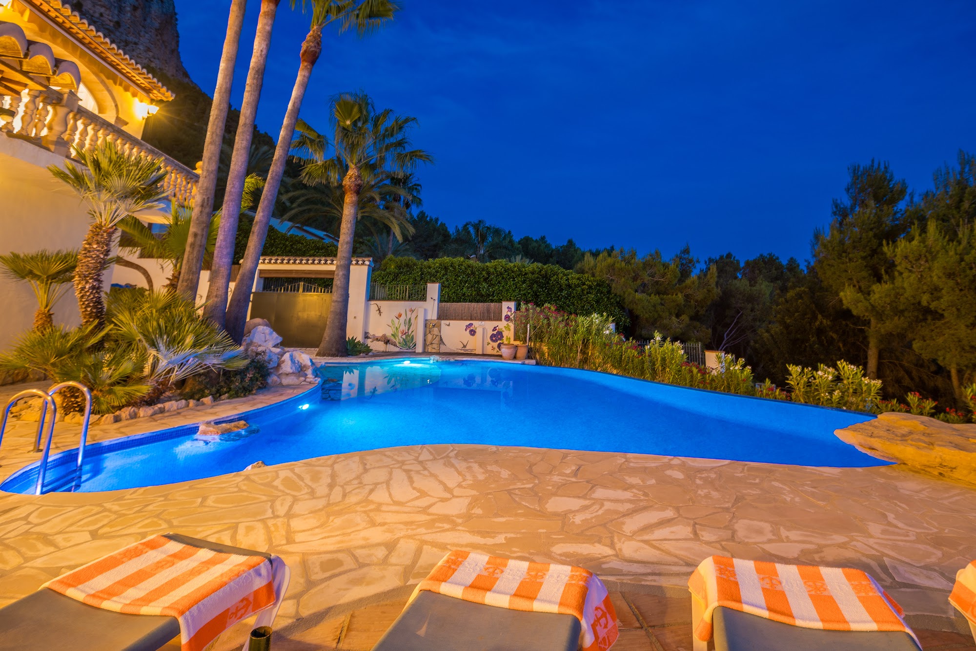 Pool illuminated blue at night
