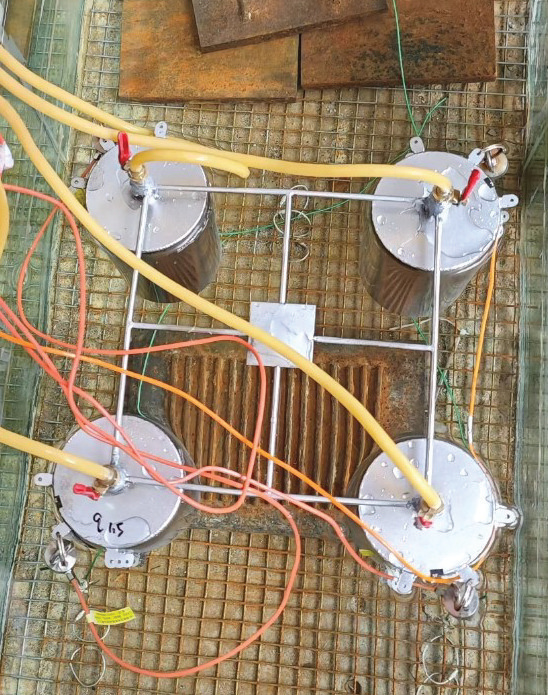 Experimental Study on Motion Response of a Taut-Moored Wind Turbine with a Four-Bucket Foundation