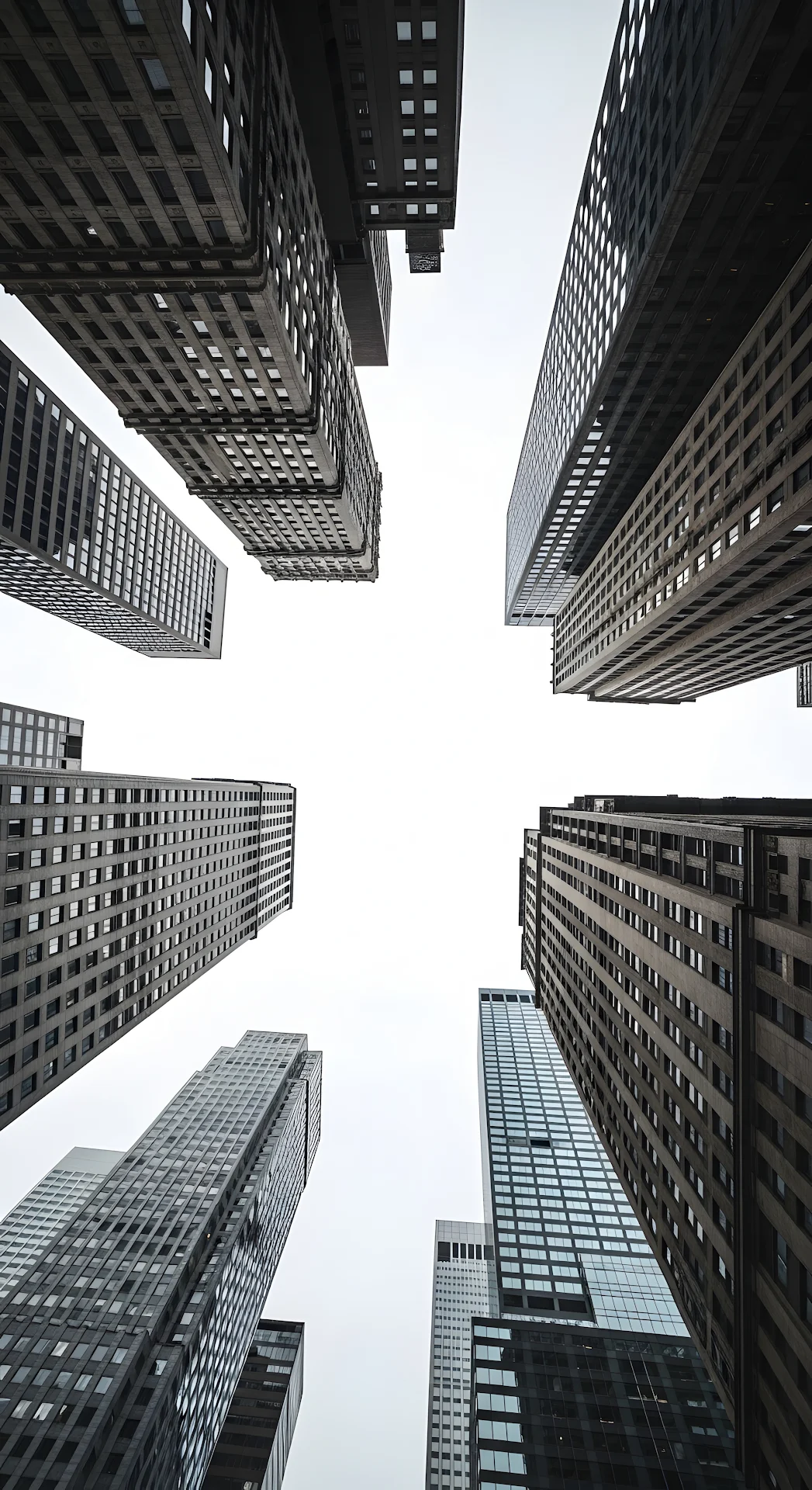 Low Angle View of Converging Dark Skyscraper Facades - Free 4K mobile Wallpaper