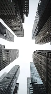 Low Angle View of Converging Dark Skyscraper Facades