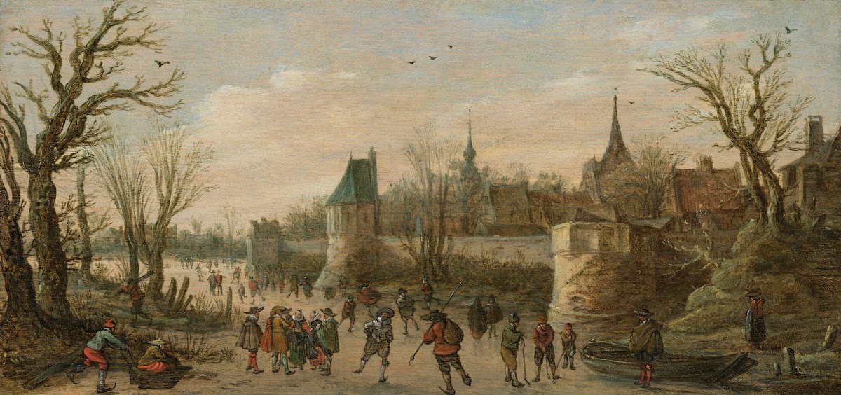 A winter landscape with townspeople ice skating before a fortified town