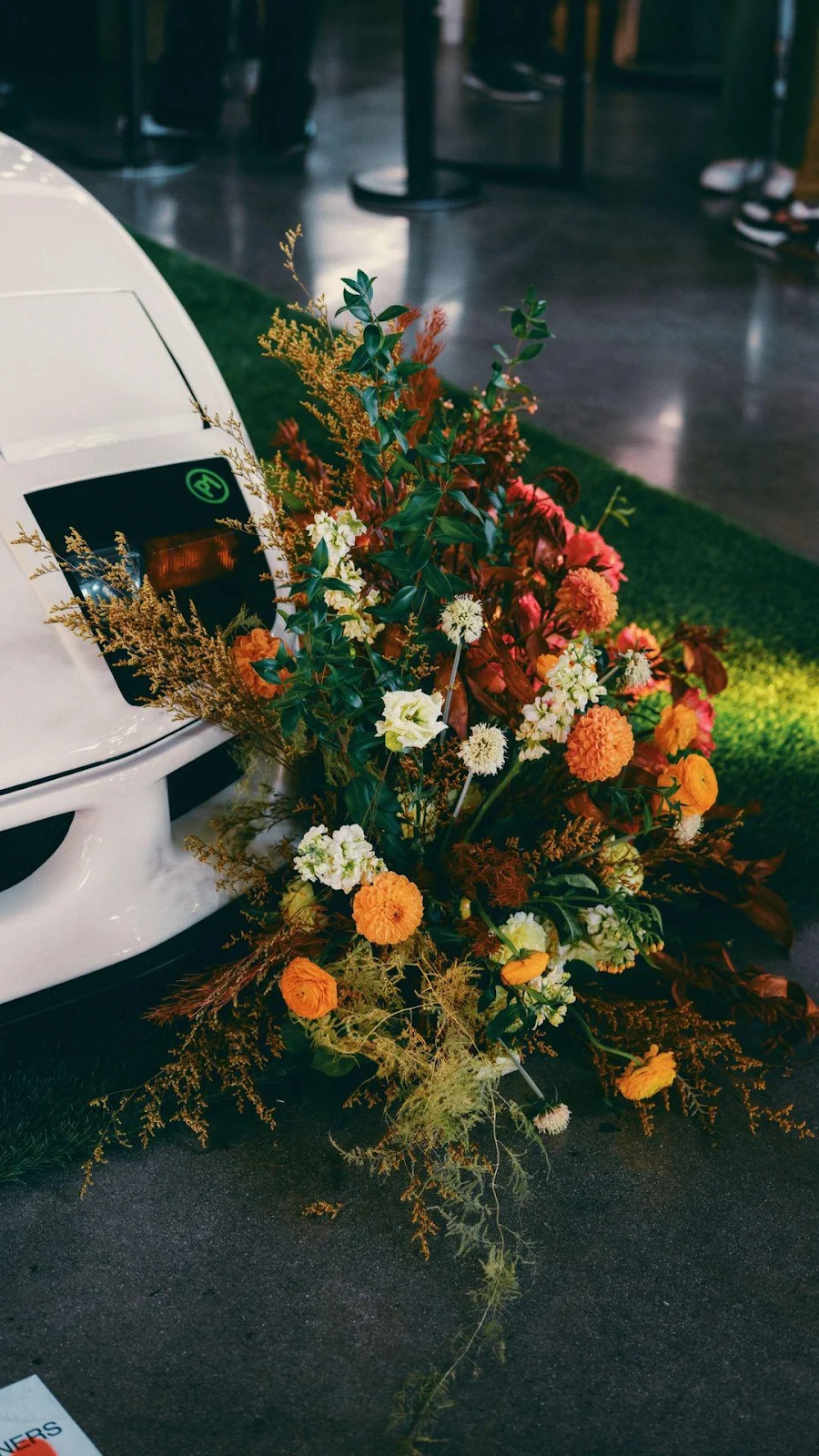 Floral Display Next to White Car - Event Photography Full HD iPhone Wallpaper (1080x1921)