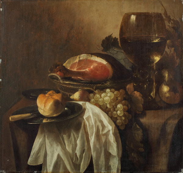 A pewter platter with a knife and bread roll a wicker basket with a joint of ham
