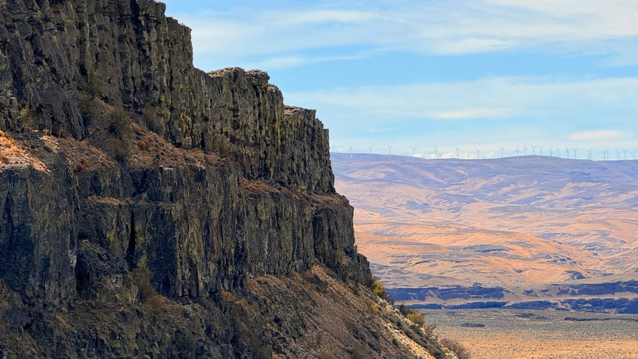 Steep columnar basalt cliffs overlooking the vast semi-arid Ice Age canyon landscape of Dry Falls