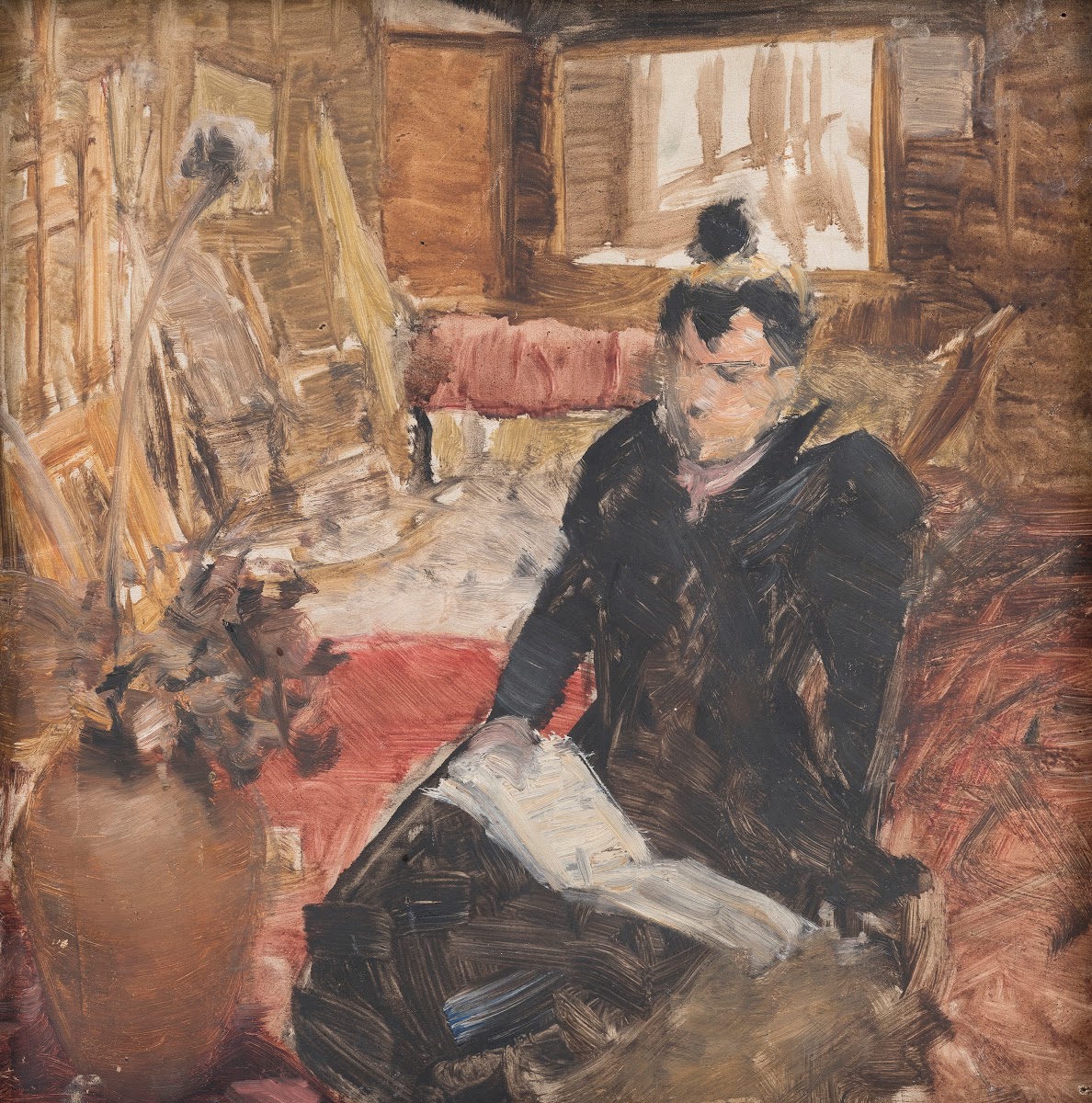 Study of a woman reading while sitting on the studio floor 1900