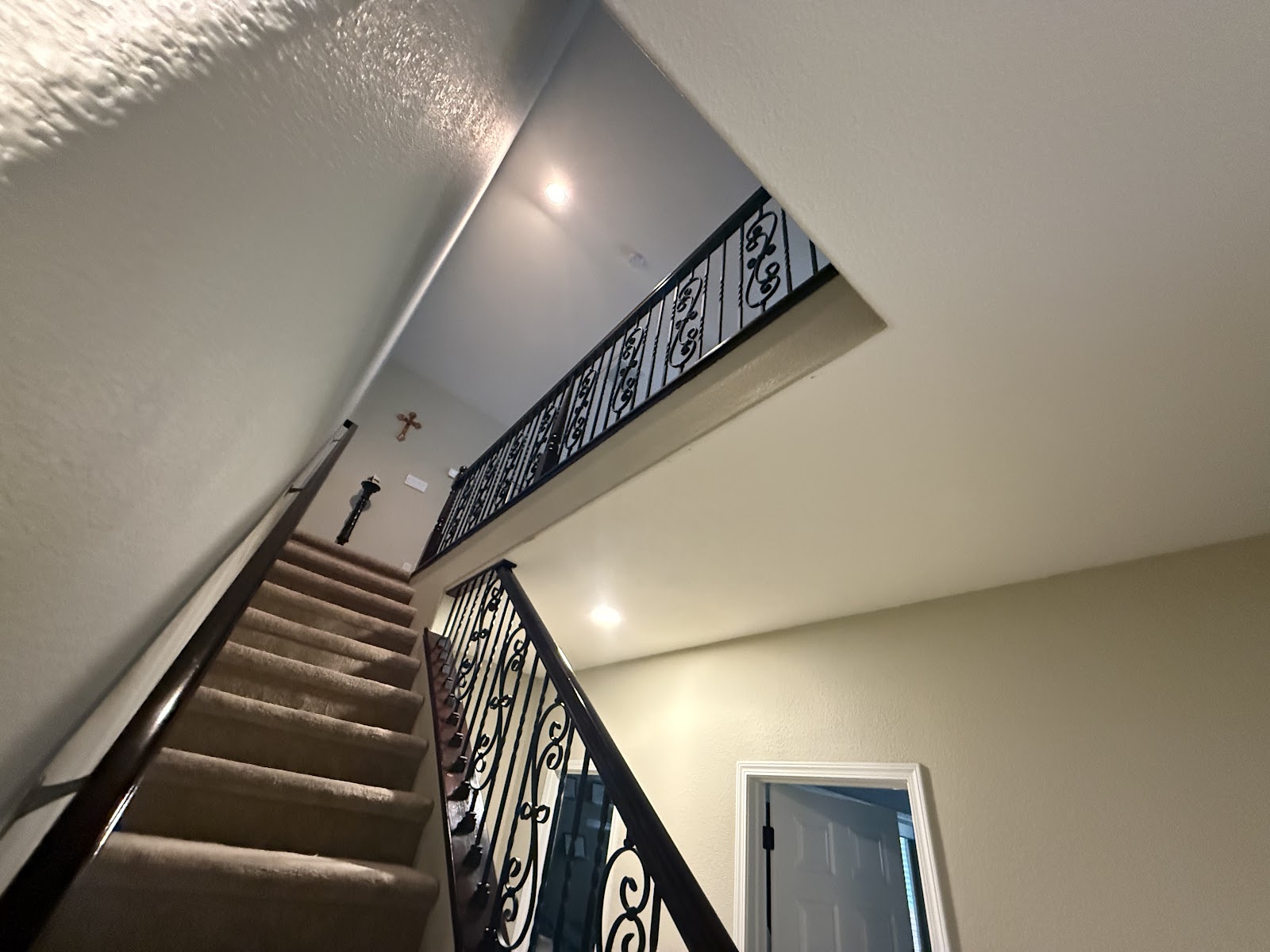Staircase with decorative iron balusters