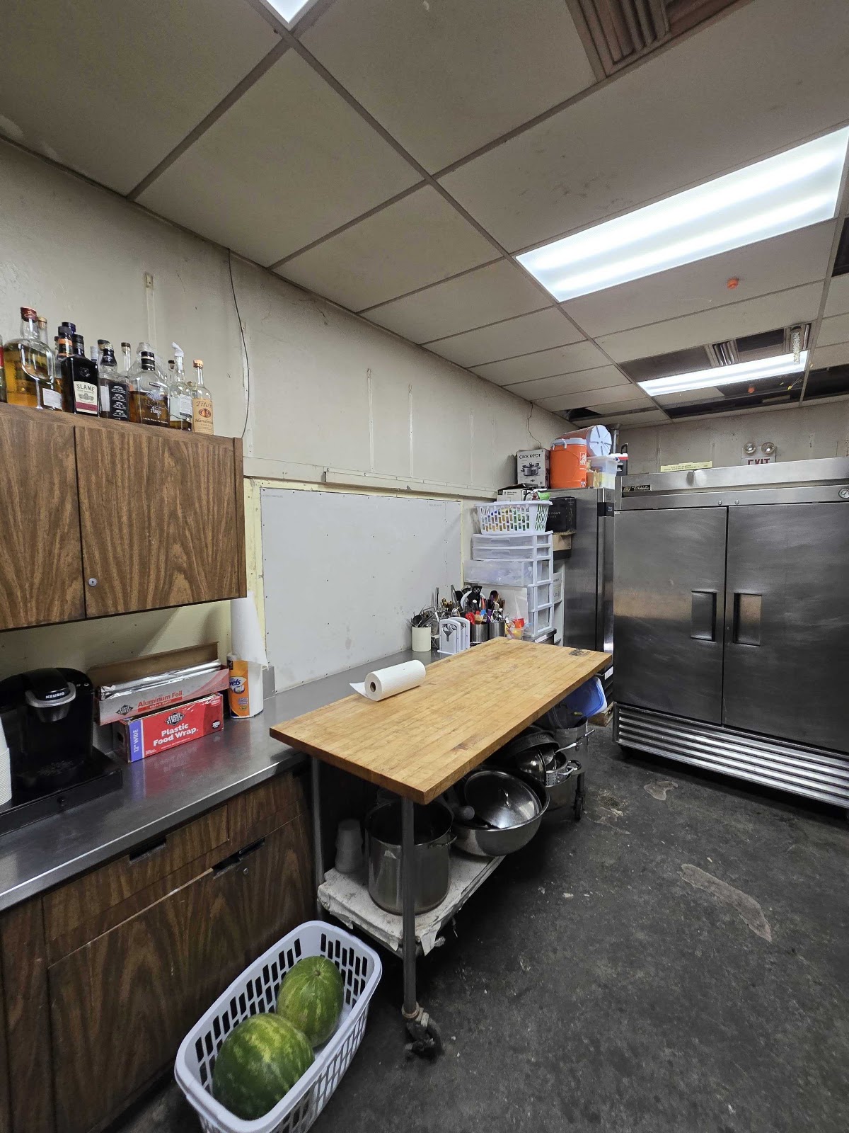Commercial kitchen wall and cabinet area — completed
