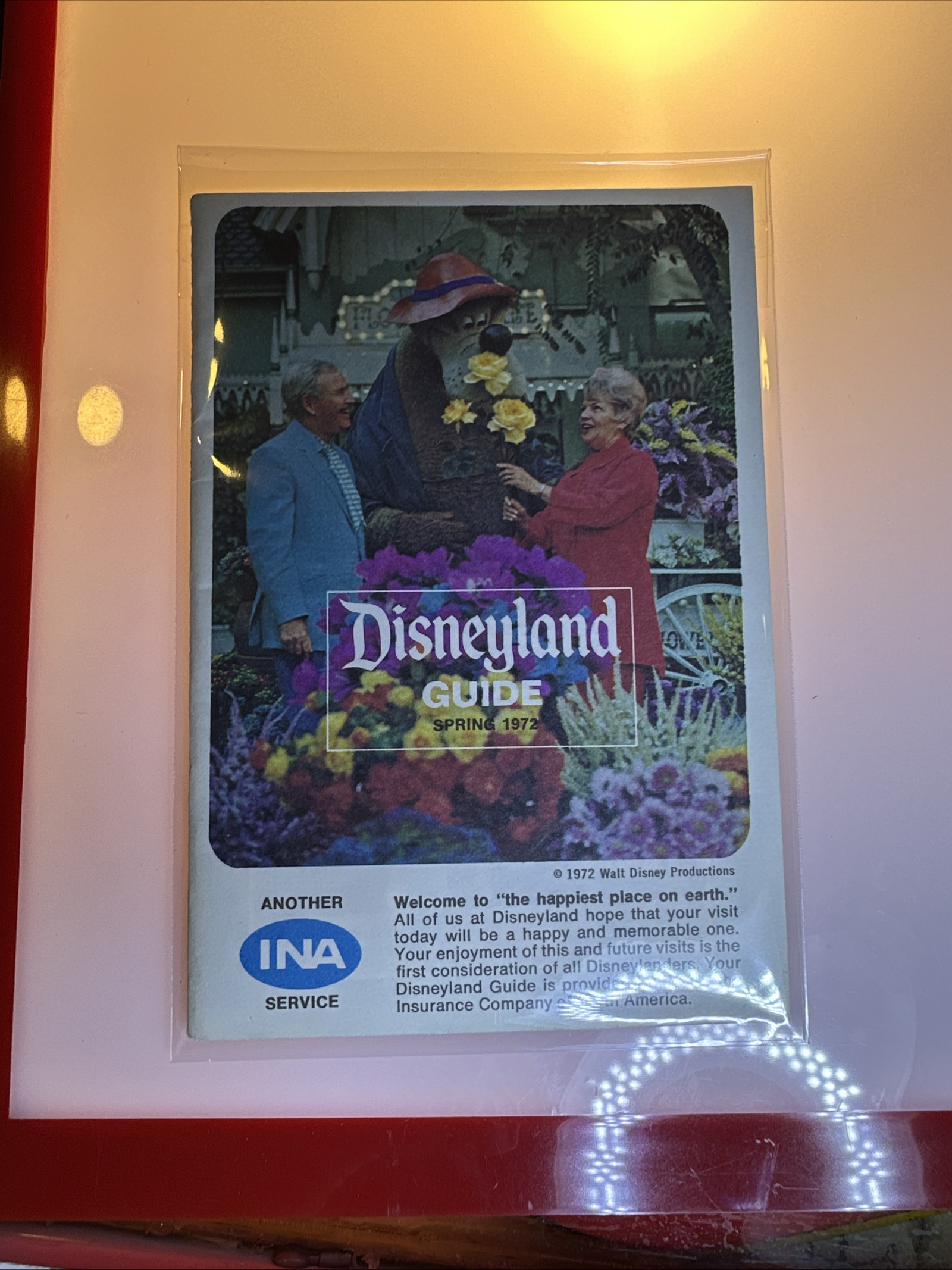 1972 Disneyland Spring guest guidebook, 4x6 inches, featuring Br'er Bear on the cover with INA Carefree Corner sponsor logo, stored in archival plastic sleeve