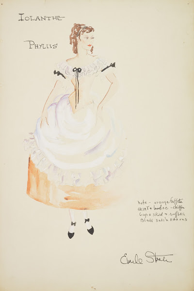 Iolanthe Phyllis orange dress with white ruffled neckline and white apron 1934 1