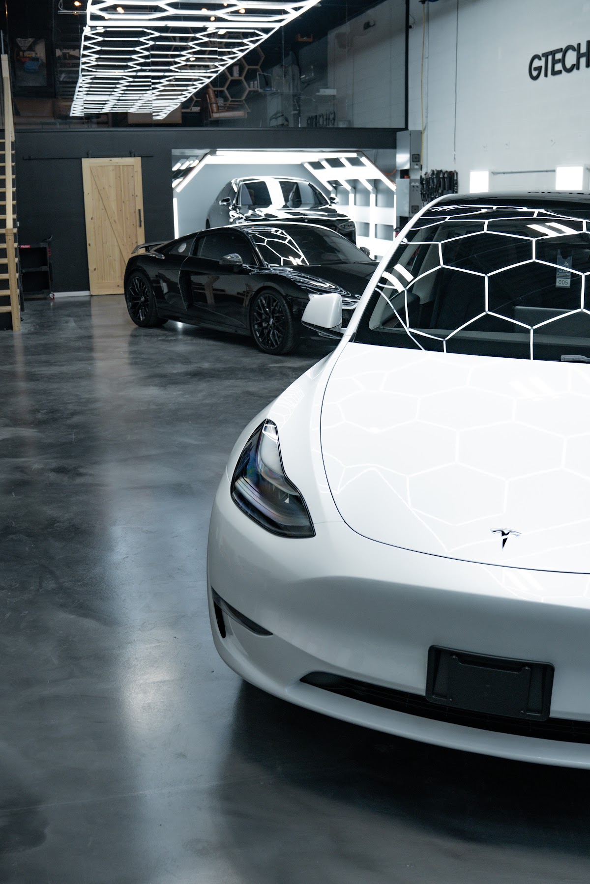 Tesla Model Y detailed under the ZAutoCare light tunnel