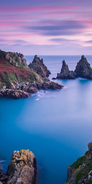 Rugged Sea Cliffs at Dusk 4K Wallpaper Background