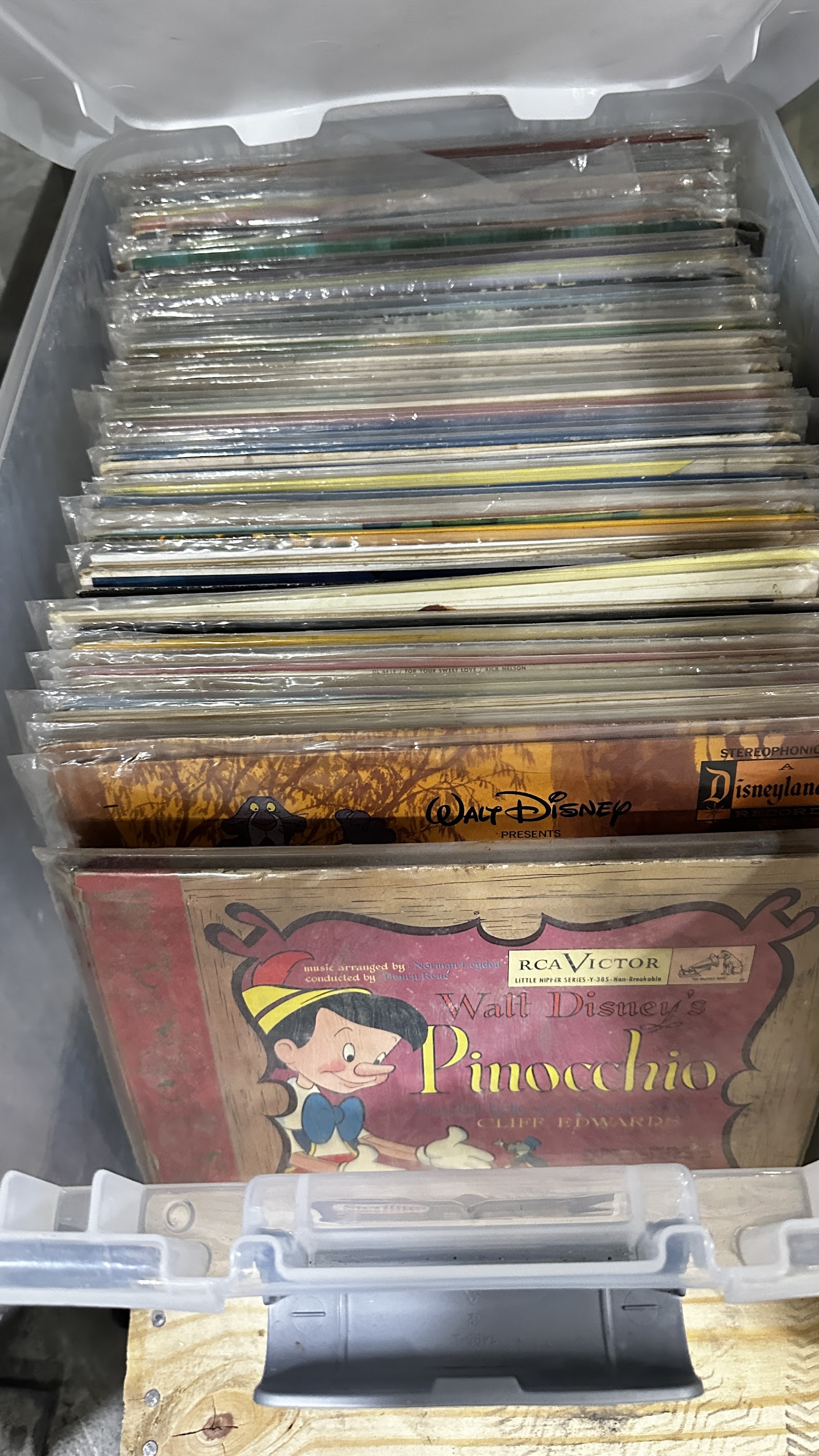 Mixed lot of vintage Disney vinyl records including LPs and 7-inch singles from the 1960s through 1980s, showing illustrated sleeves with various Disney characters