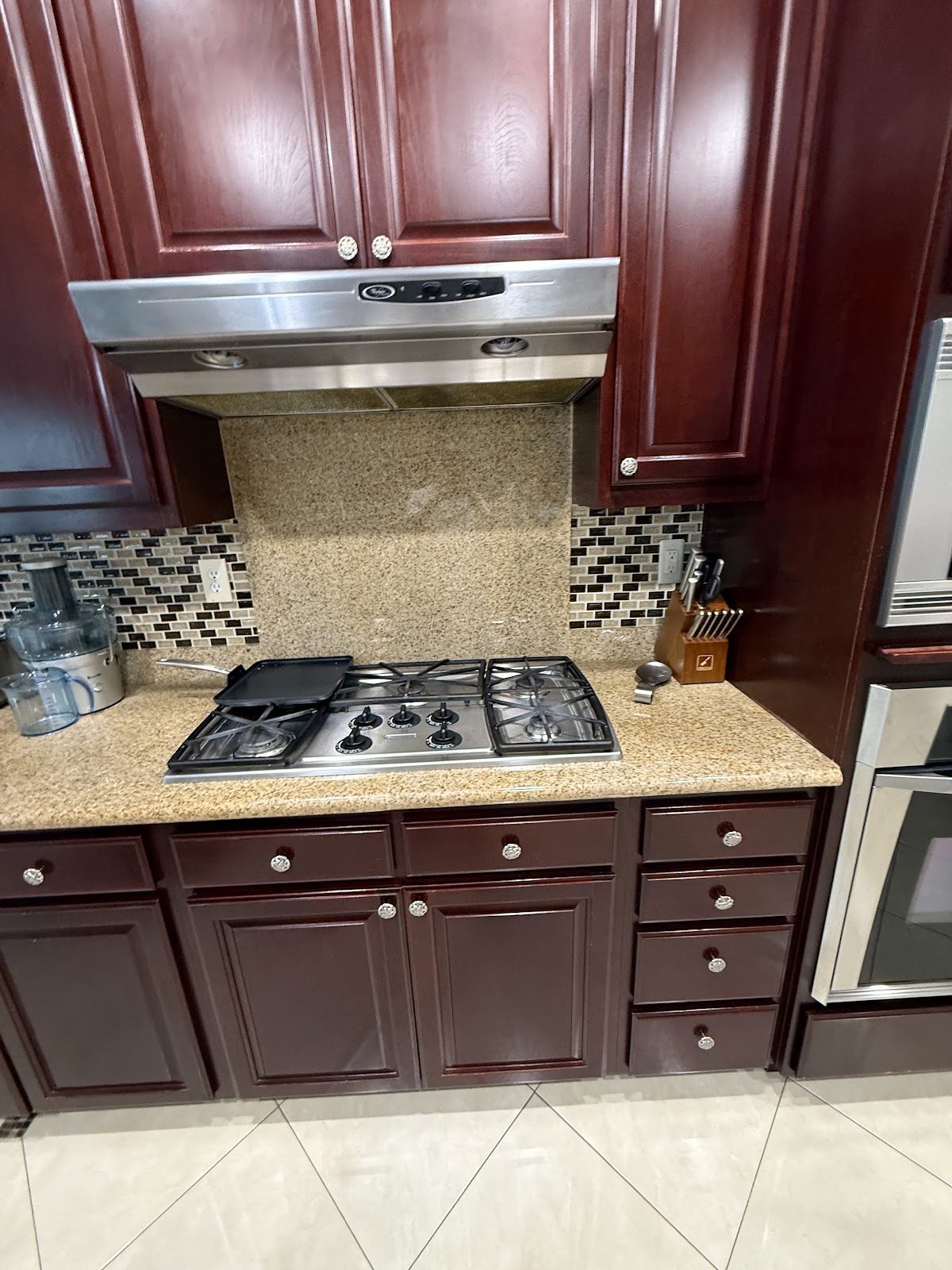 Gas cooktop with mosaic tile backsplash