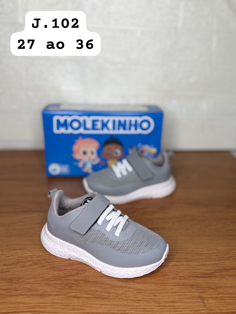 Zapatilla de fútbol infantil con diseño de rayas doradas · foto 2