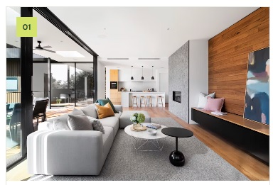 Open-plan living room with a timber-look feature wall