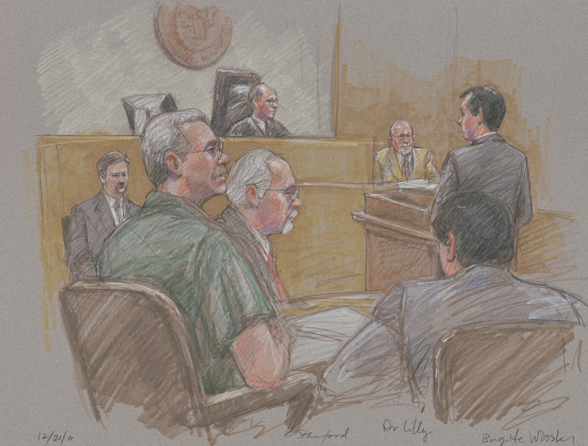 Robert Allen Stanford seated in courtroom with lawyers judge and others during h
