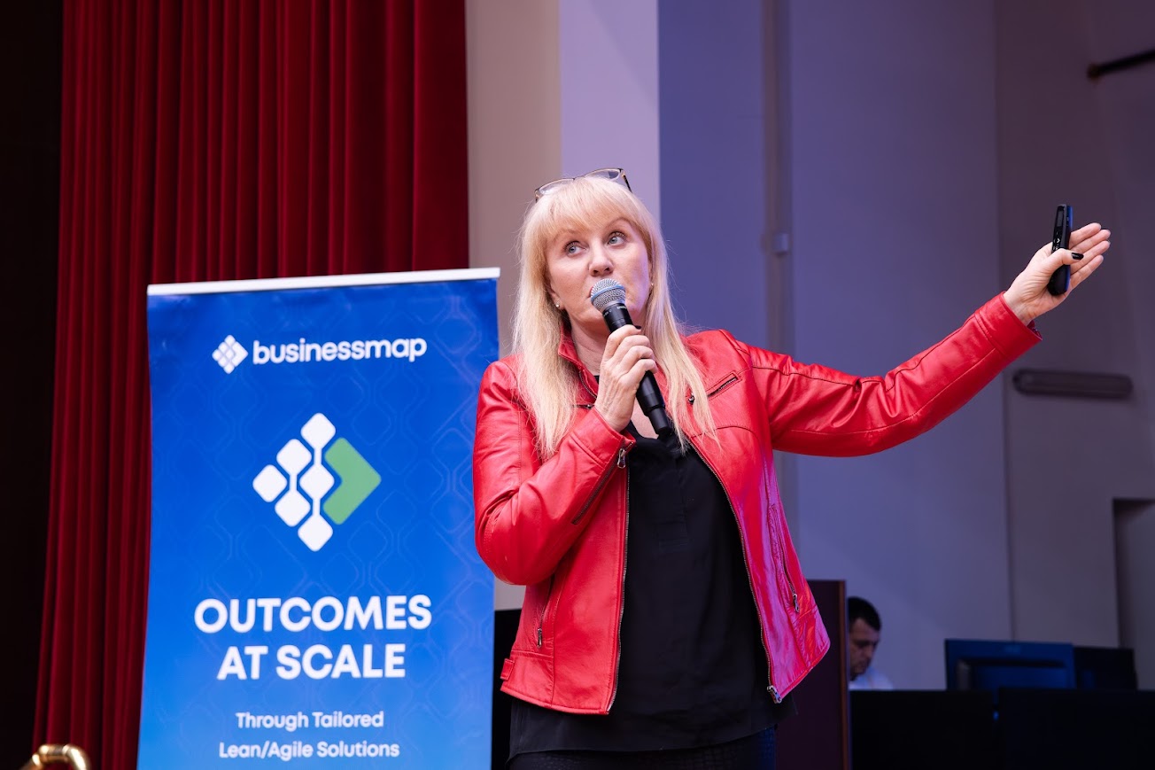 Sue speaking at an industry conference