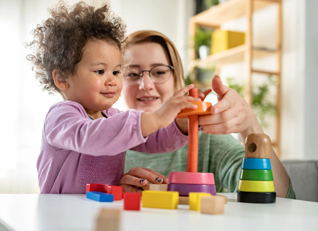 Paediatric clinician with child — online paediatric dysphagia and feeding courses for speech therapists