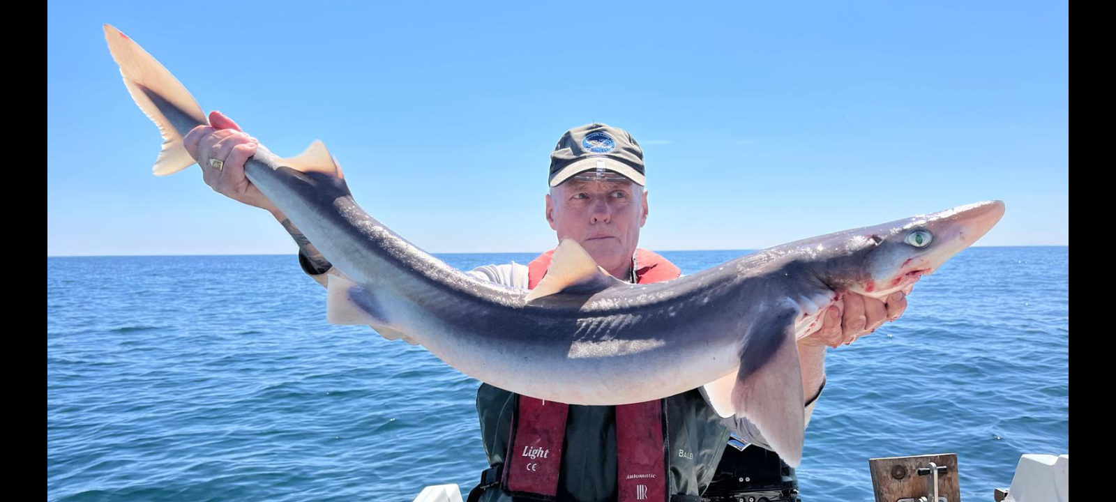 Erin McCartney with a Spurdog caught on a mackerel flapper at Port Logan