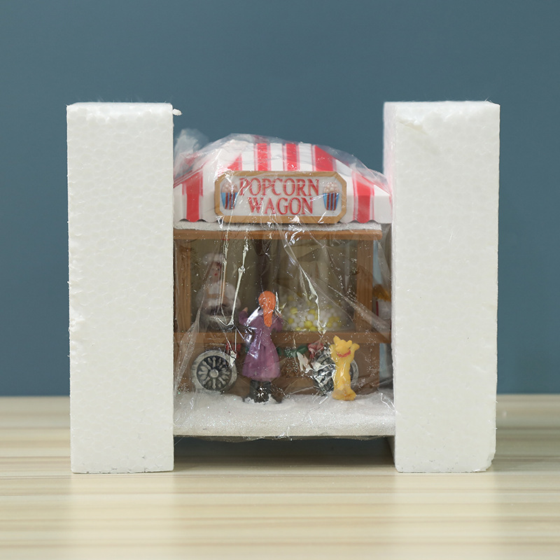 Decorative illuminated Christmas popcorn house made of resin
