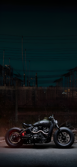 Custom Indian Motorcycle Parked at Night Industrial Setting - Free mobile Wallpaper