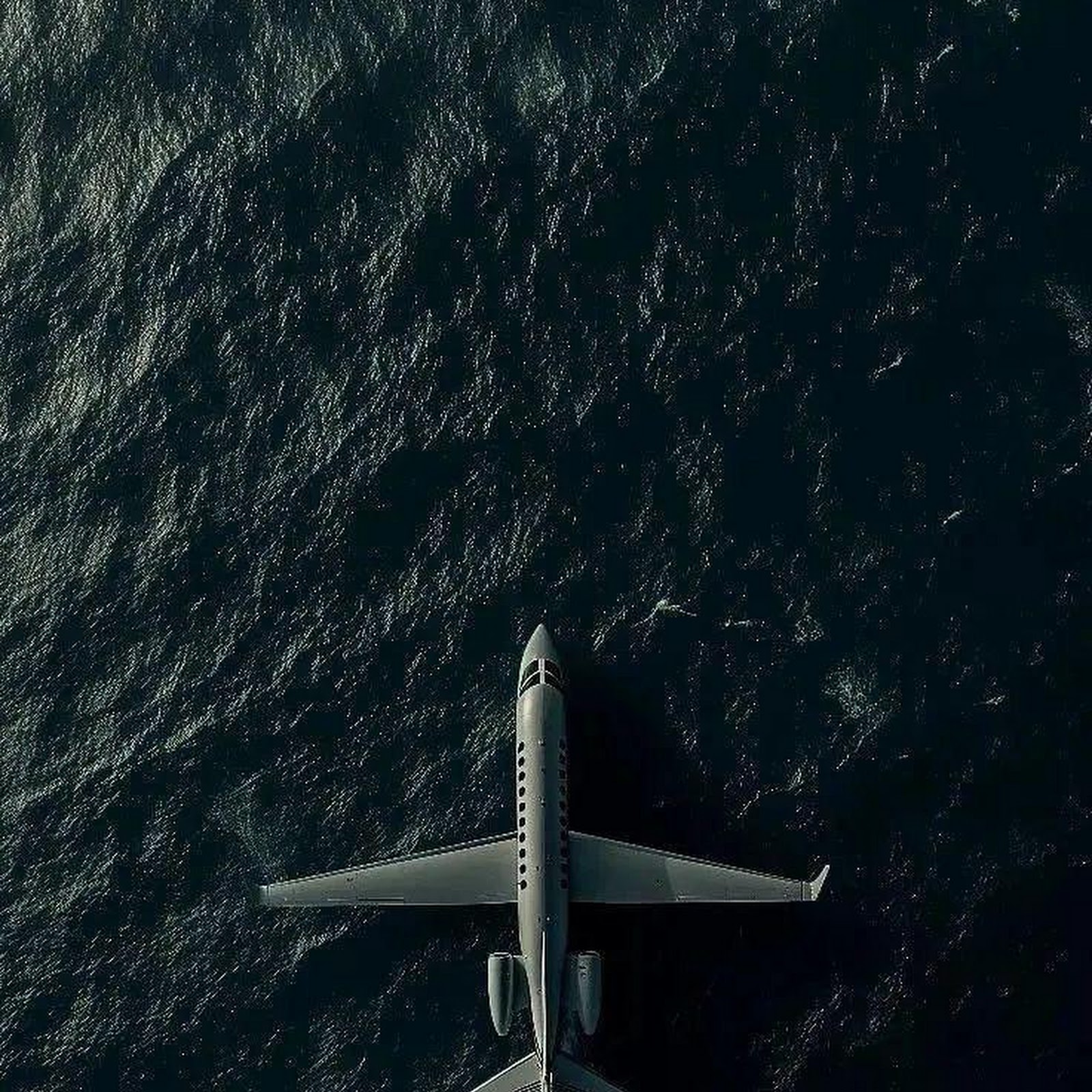 Download Private Jet Over Deep Ocean iPhone