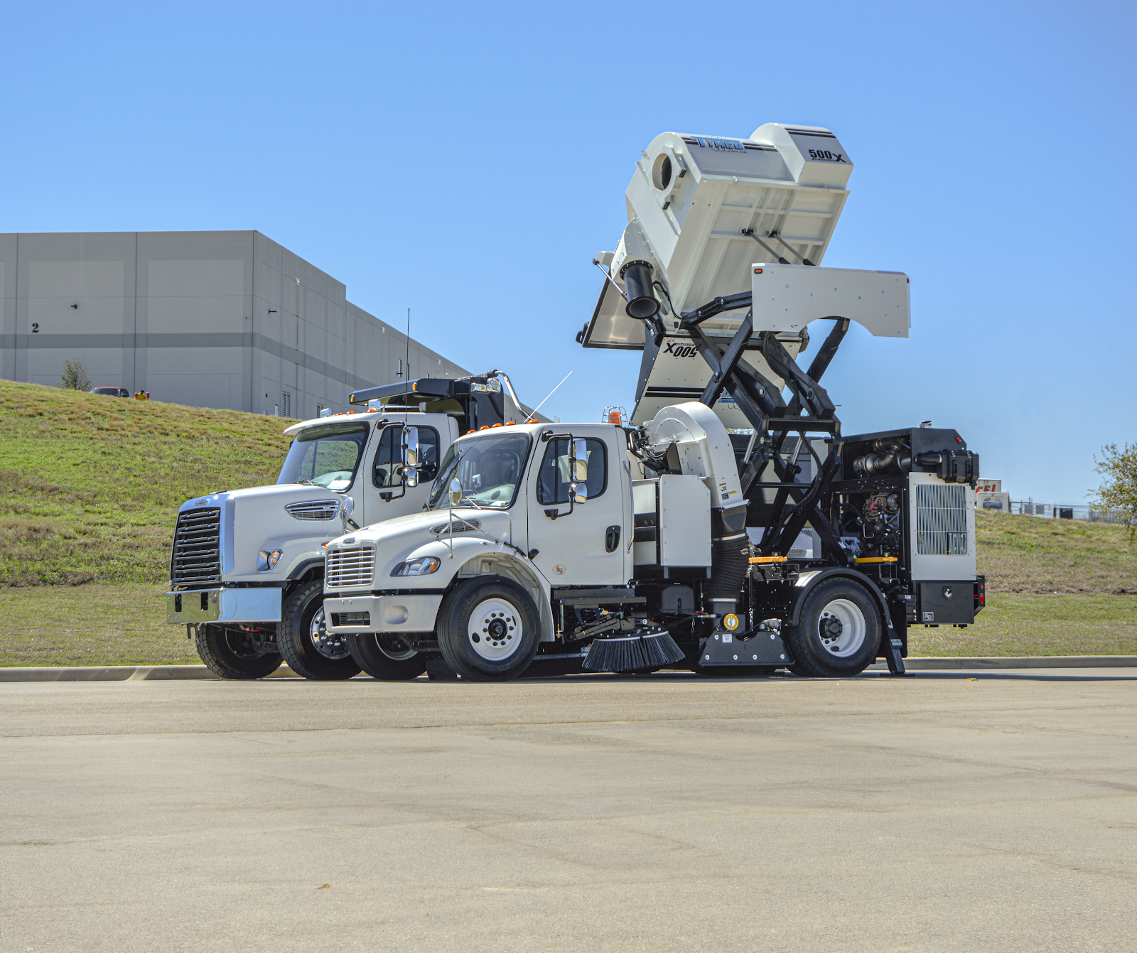 TYMCO regenerative air street sweeper shown in a heavy-duty work application