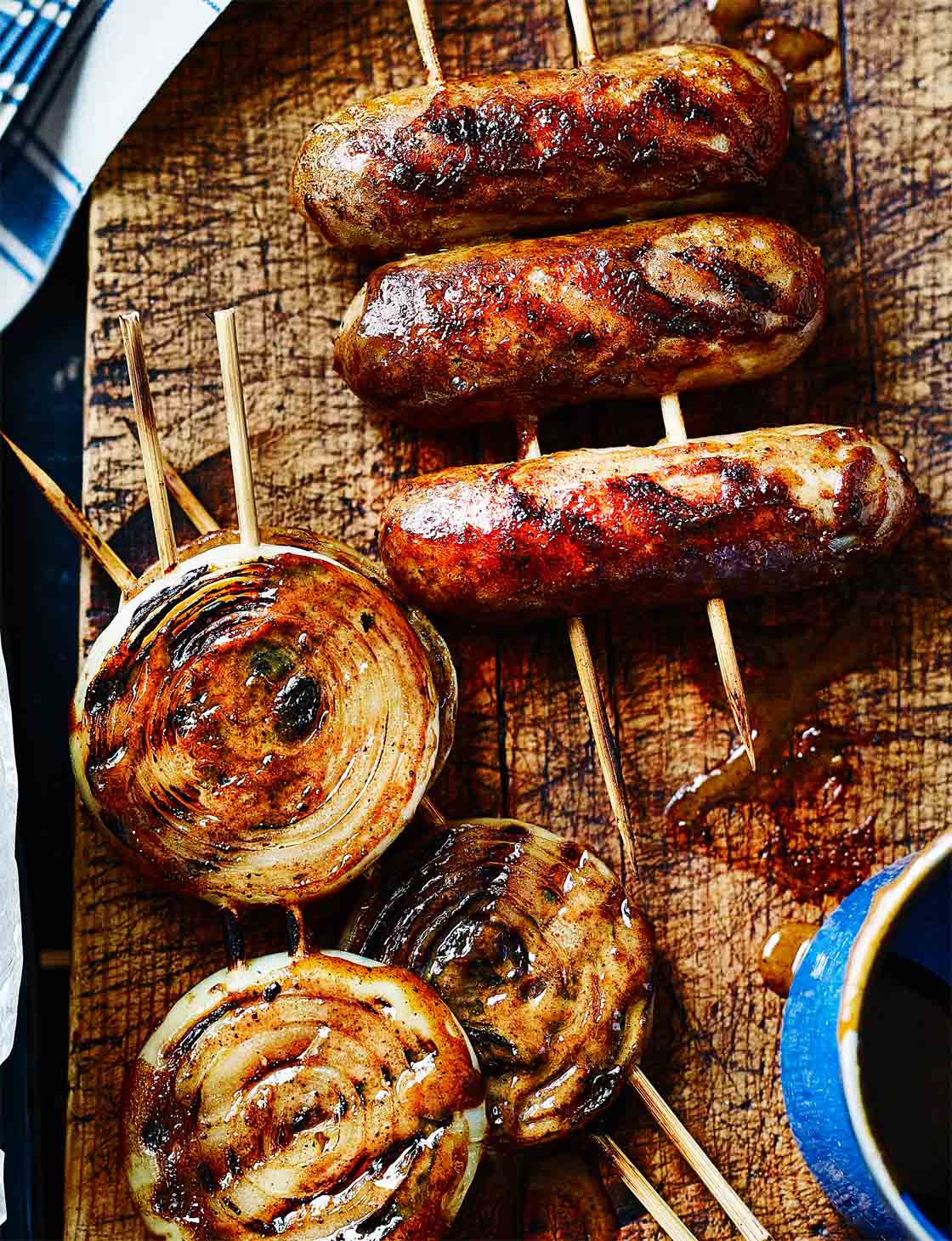 Charcoal-Grilled Sausages With Onions