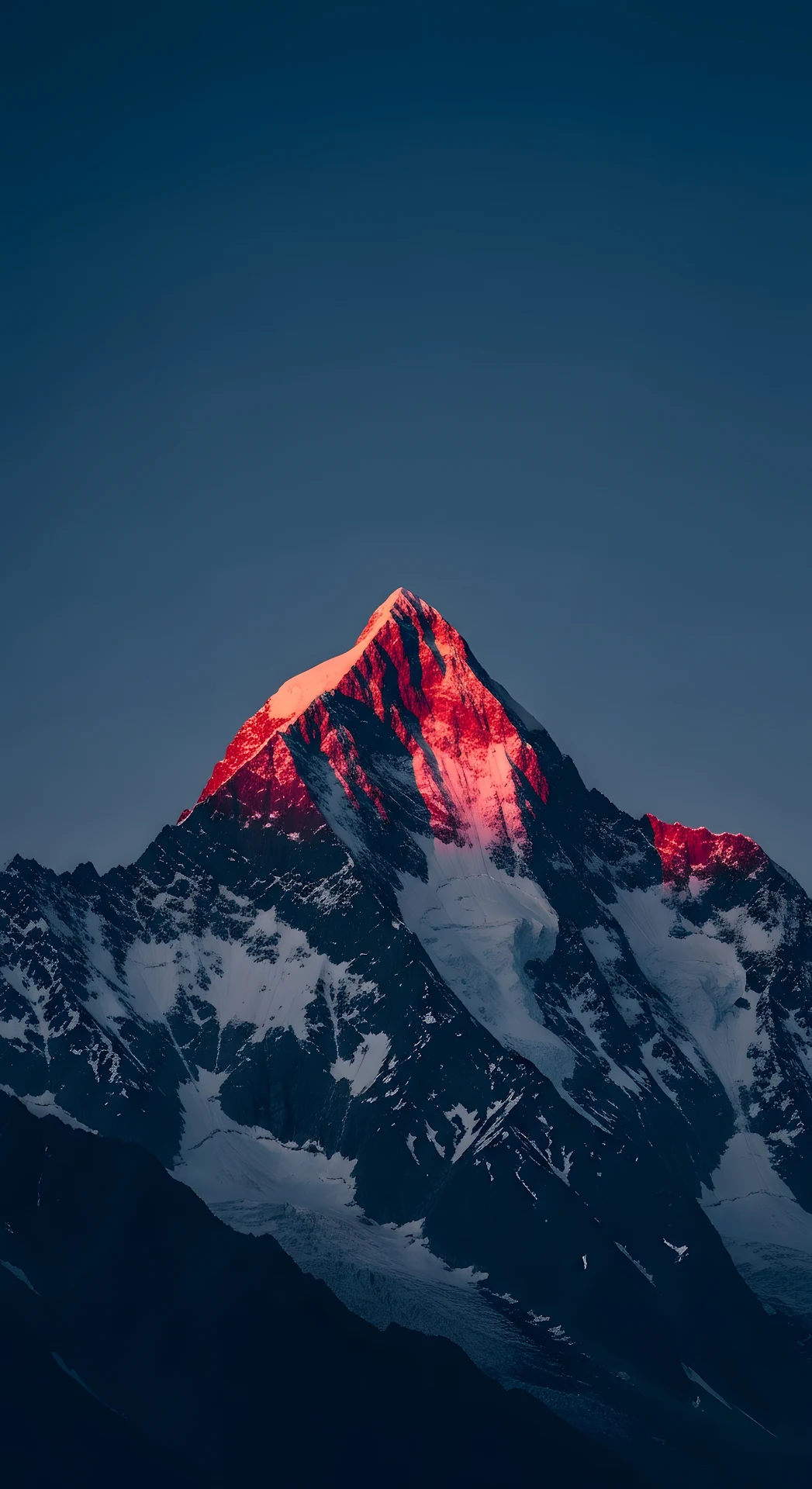 Dramatic Vertical Photo of Snowy Alpine Mountain Peak with Alpenglow at Sunrise - Free 4K mobile Wallpaper