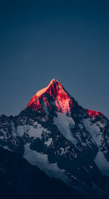 Dramatic Vertical Photo of Snowy Alpine Mountain Peak with Alpenglow at Sunrise - Free mobile Wallpaper