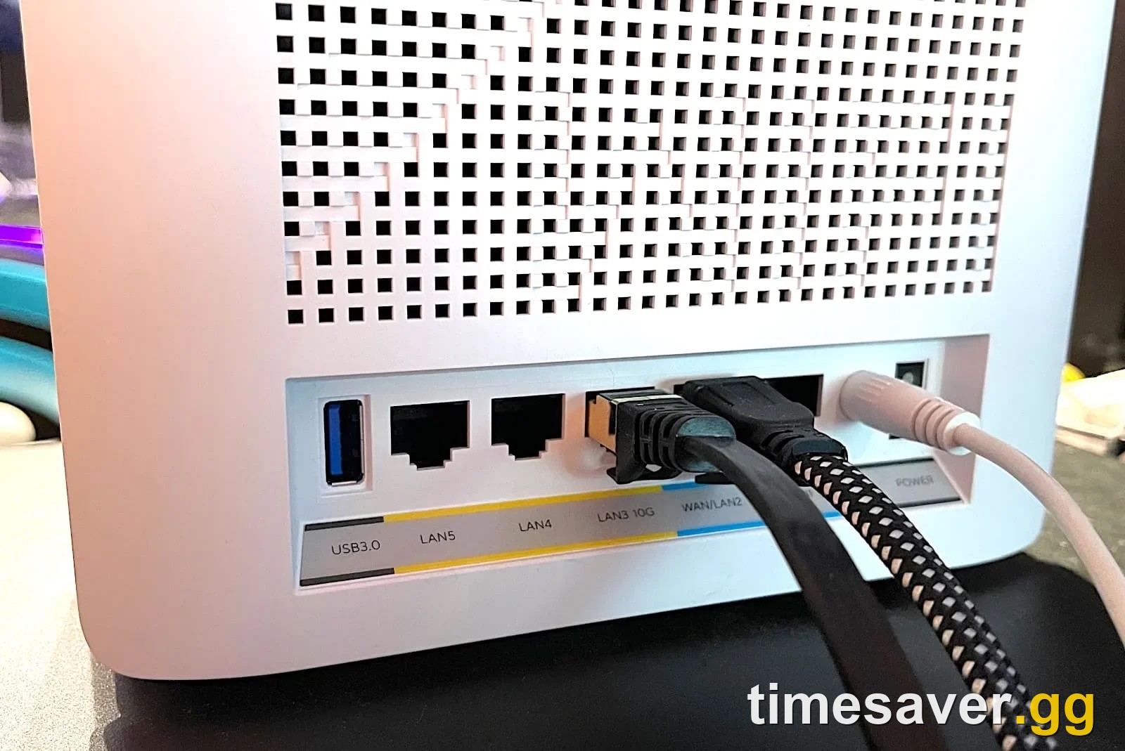 Wired Ethernet cables connected to a router's LAN ports — the single biggest fix for Warzone rubberbanding and high ping