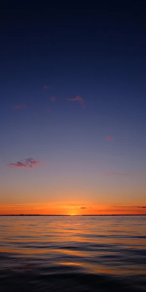 Sunset Over Calm Water Full HD iPhone Wallpaper Background
