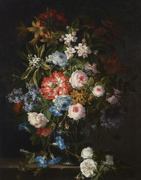 Roses lilies tulips daffodils morning glories and other flowers in a glass vase