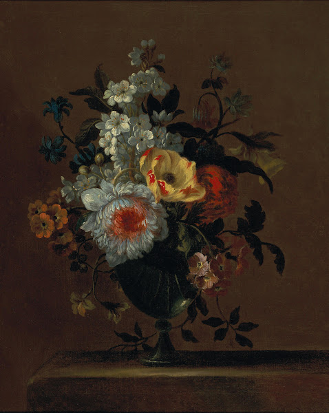 Flowers in a glass vase on a pedestal