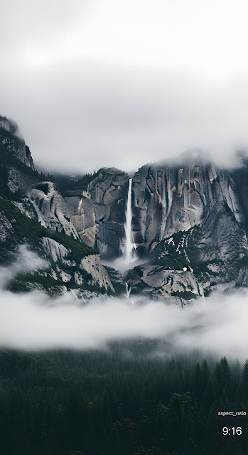 Dramatic Waterfall Cascading Through Foggy Mountain Cliffs - Free mobile Wallpaper
