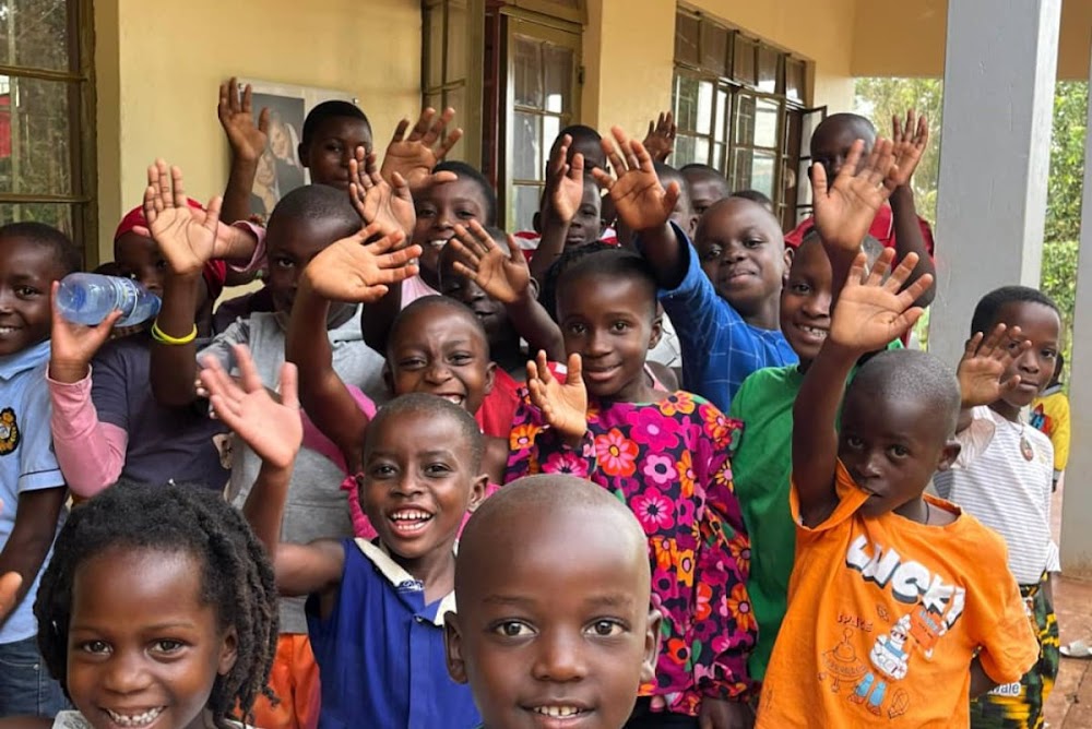 Children waving with joy