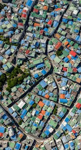 Dense Urban Landscape Aerial with Brightly Colored Rooftops