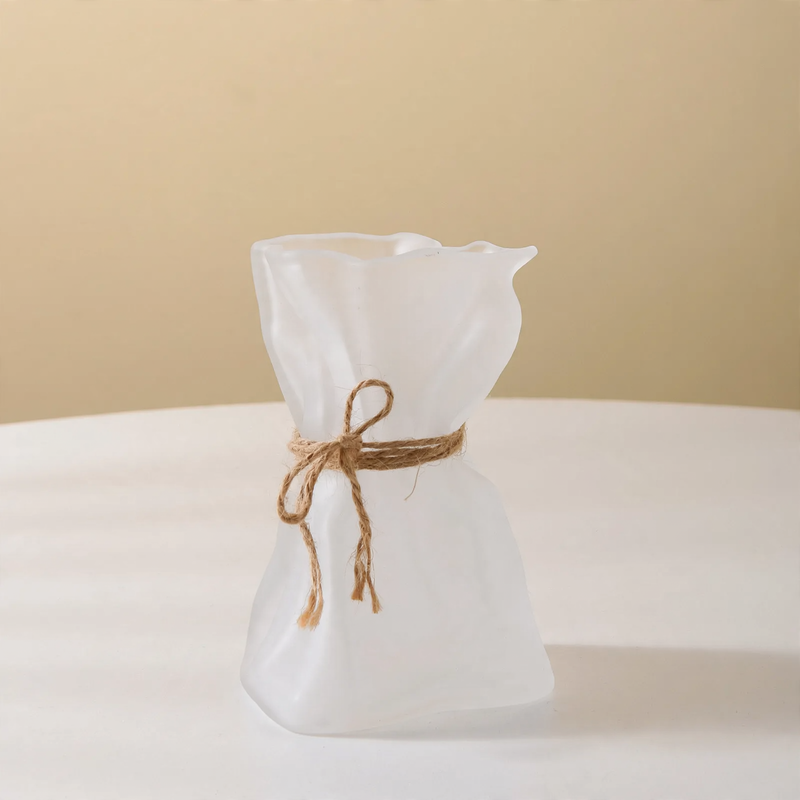 Glass vase with irregular folding pattern