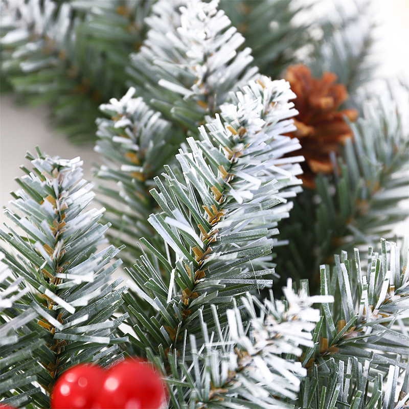 Christmas wreath with berries and pine cones