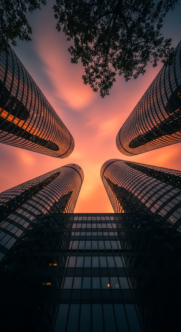 Dramatic Worm's Eye View of Modern City Skyscrapers at Sunset