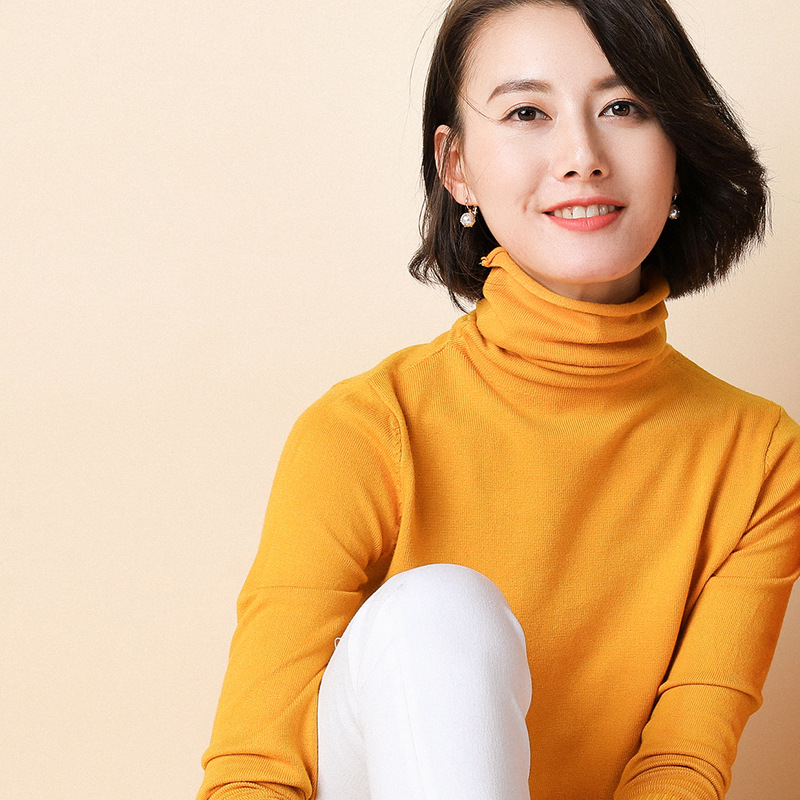 Women's knit sweater with standing collar and geometric pattern